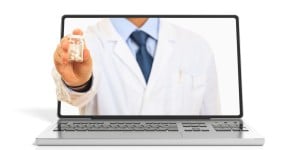 Online doctor dispensing medication through laptop screen