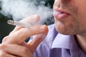Close up shot of man smoking a cigarette